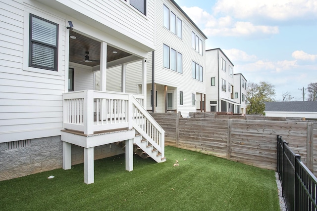 exterior space with ceiling fan