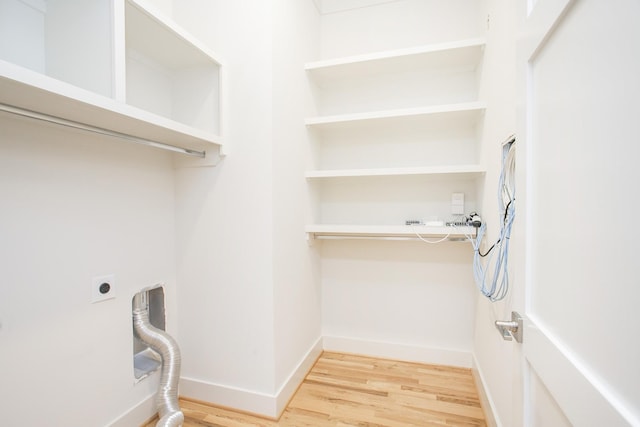 laundry area featuring hardwood / wood-style floors and electric dryer hookup