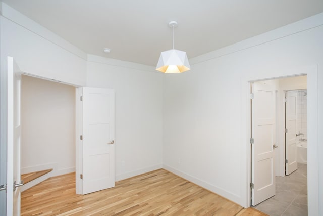 unfurnished room featuring wood-type flooring