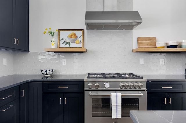 kitchen featuring decorative backsplash, light stone counters, high end stainless steel range, and wall chimney exhaust hood