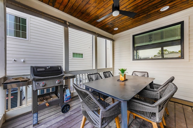 wooden deck featuring ceiling fan