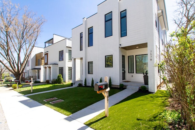 view of front of home with a front yard