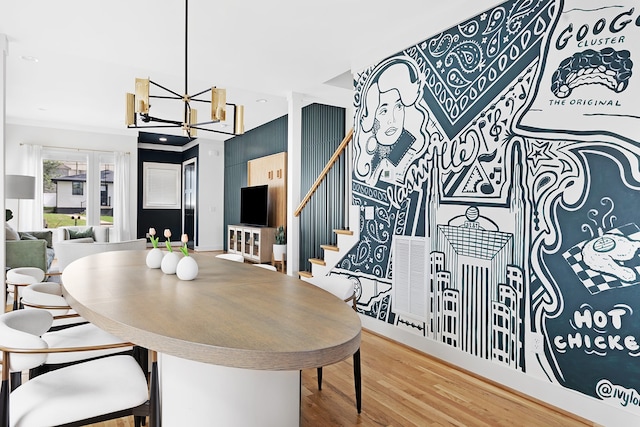 dining room featuring hardwood / wood-style floors and a notable chandelier