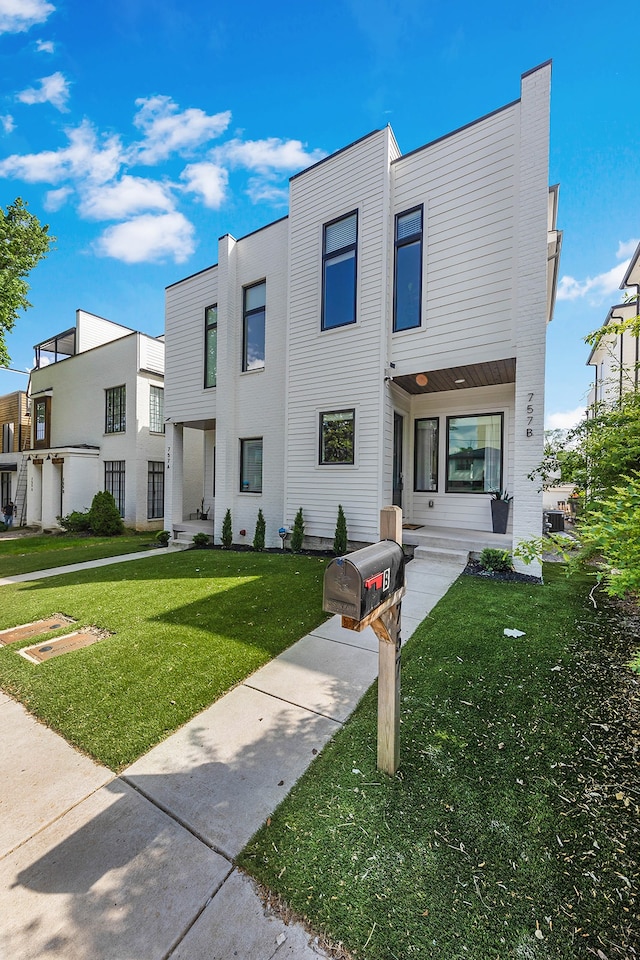 contemporary home featuring a front yard