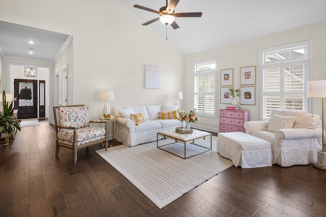 living room featuring ceiling fan, dark hardwood / wood-style flooring, high vaulted ceiling, and crown molding