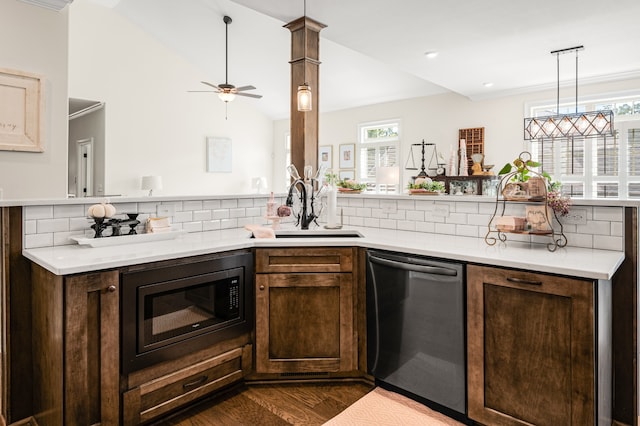 kitchen featuring backsplash, black microwave, a healthy amount of sunlight, and stainless steel dishwasher