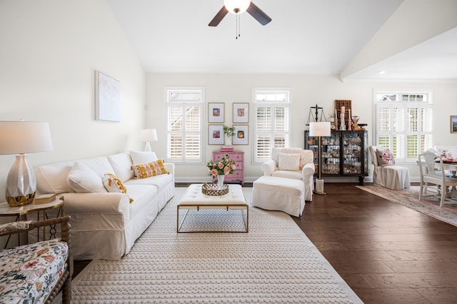 living room with ceiling fan, lofted ceiling, and hardwood / wood-style flooring