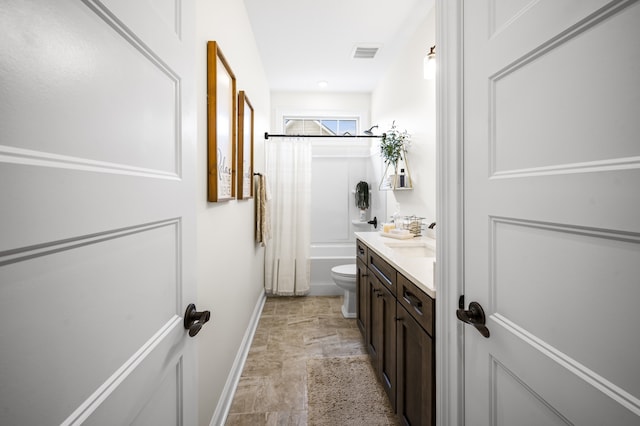 full bathroom featuring vanity, toilet, and shower / bath combo with shower curtain