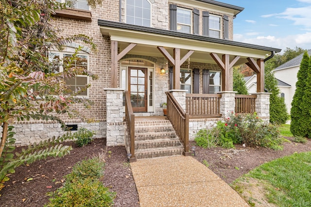 entrance to property featuring covered porch