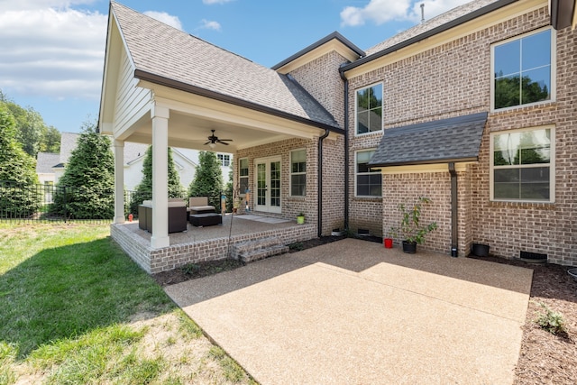 back of property with a patio area, ceiling fan, and a yard