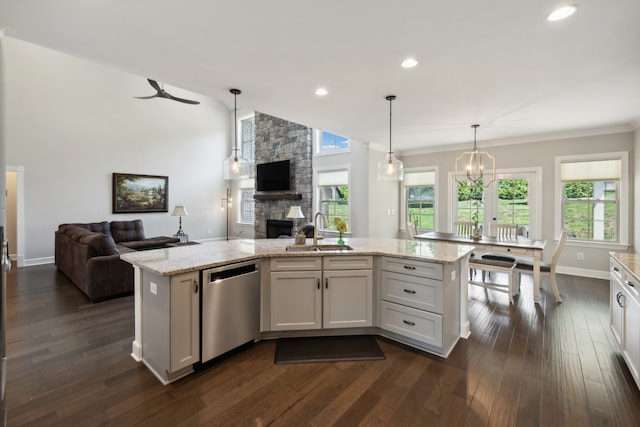 kitchen featuring a kitchen island with sink, dark wood-type flooring, sink, dishwasher, and white cabinetry