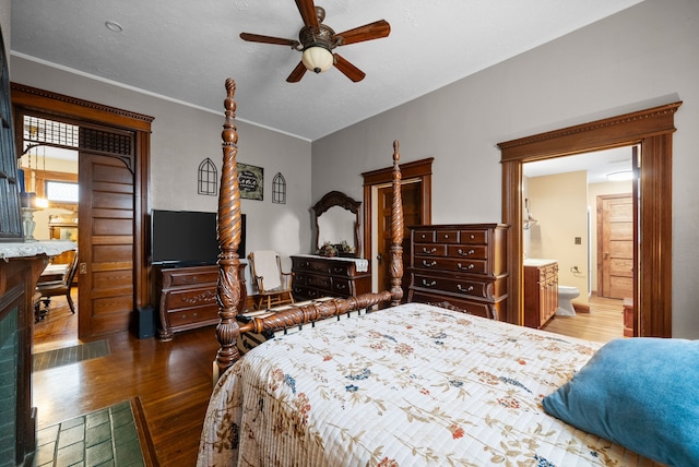 428 N Main St, Trenton, KY 42286 - bedroom with a textured ceiling, ensuite bath, ceiling fan, and dark hardwood / wood-style floors