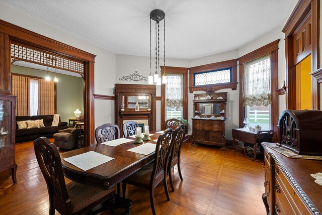 428 N Main St, Trenton, KY 42286 - dining area featuring a textured ceiling, dark wood-type flooring, and a wealth of natural light