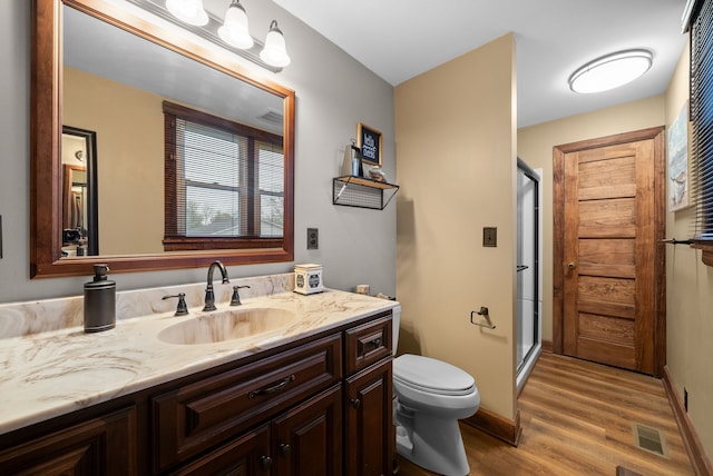 428 N Main St, Trenton, KY 42286 - bathroom with toilet, vanity, wood-type flooring, and walk in shower