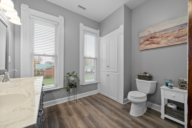 428 N Main St, Trenton, KY 42286 - bathroom featuring hardwood / wood-style flooring, vanity, and toilet