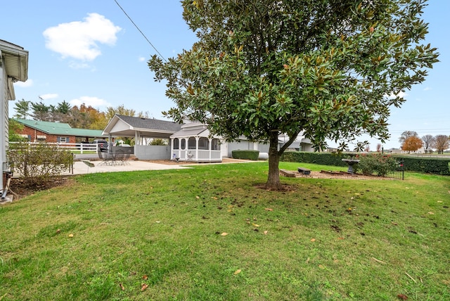 428 N Main St, Trenton, KY 42286 - view of yard featuring a patio area and a sunroom