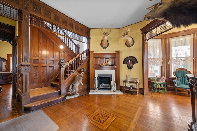 428 N Main St, Trenton, KY 42286 - living room featuring hardwood / wood-style flooring, wood walls, and a high ceiling