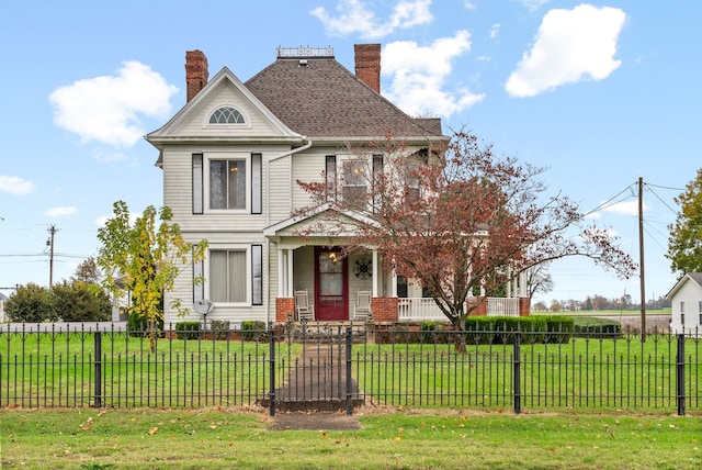 view of front of house featuring a porch and a front lawn