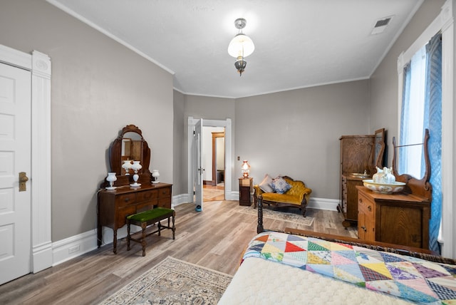 428 N Main St, Trenton, KY 42286 - bedroom with light hardwood / wood-style floors and crown molding