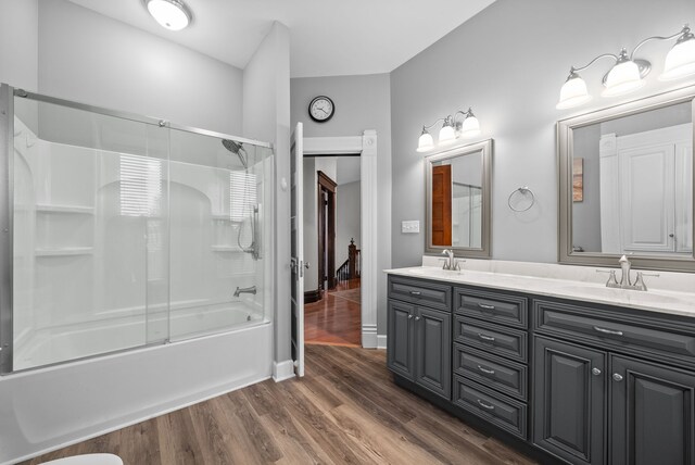 428 N Main St, Trenton, KY 42286 - bathroom featuring shower / bath combination with glass door, hardwood / wood-style floors, and vanity