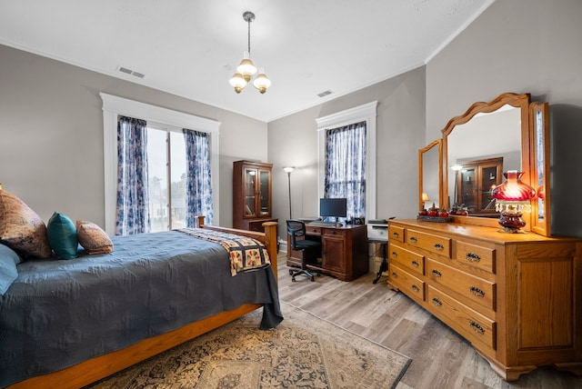 428 N Main St, Trenton, KY 42286 - bedroom with crown molding, a chandelier, and light wood-type flooring