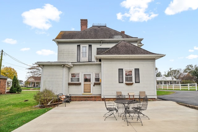 428 N Main St, Trenton, KY 42286 - back of house featuring a lawn and a patio area