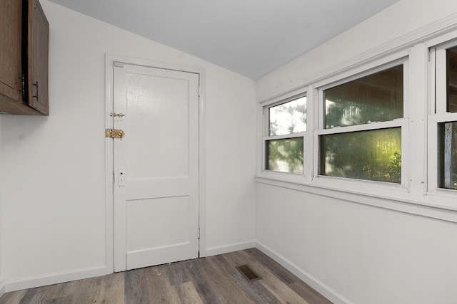 1206 Peter Pan Rd, Lookout Mountain, GA 30750 - unfurnished room with wood finished floors, lofted ceiling, and baseboards