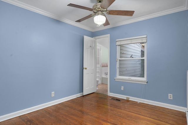 unfurnished room with crown molding, built in features, ceiling fan, and dark wood-type flooring