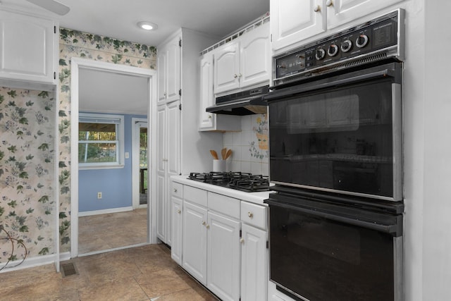 1206 Peter Pan Rd, Lookout Mountain, GA 30750 - kitchen with black appliances, baseboards, wallpapered walls, white cabinetry, and under cabinet range hood