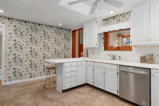 1206 Peter Pan Rd, Lookout Mountain, GA 30750 - kitchen featuring dishwasher, a sink, wallpapered walls, a ceiling fan, and baseboards