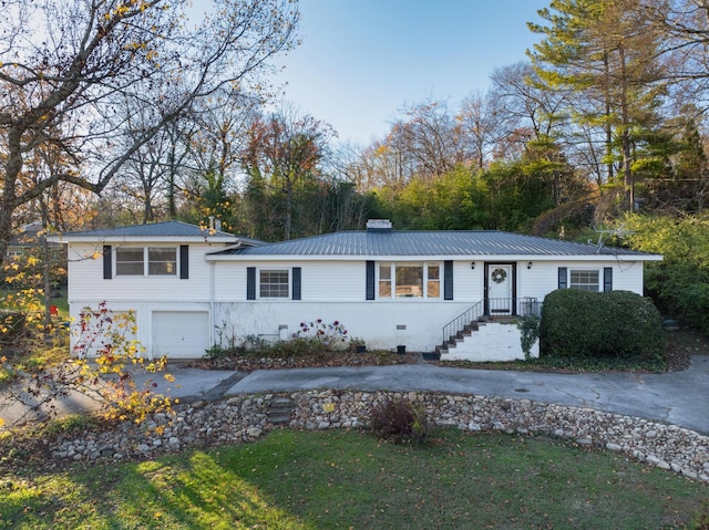 1206 Peter Pan Rd, Lookout Mountain, GA 30750 - view of front of property featuring asphalt driveway, a garage, metal roof, and a chimney