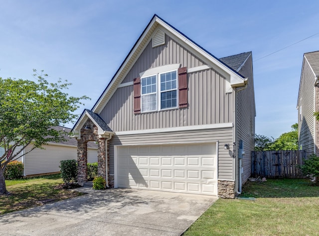 view of front of house featuring a front lawn and a garage