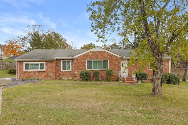 ranch-style home with a front lawn