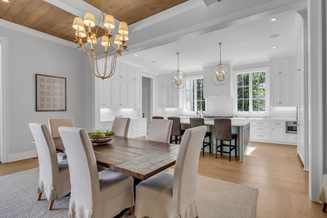 dining space with a chandelier, light hardwood / wood-style flooring, crown molding, and wood ceiling