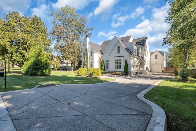 view of property exterior with a yard and a garage