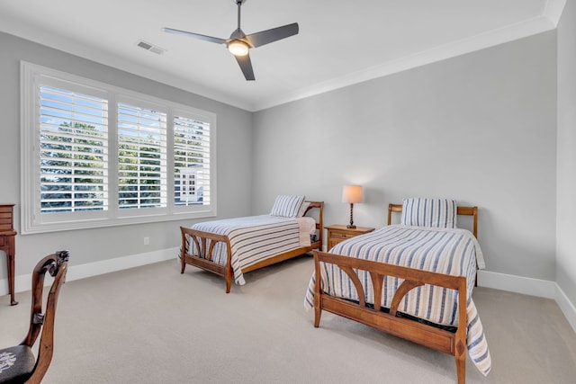 bedroom featuring ceiling fan, light carpet, and ornamental molding