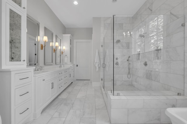 bathroom featuring vanity and separate shower and tub