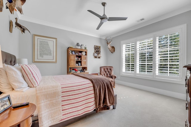 bedroom featuring light colored carpet, ceiling fan, and ornamental molding