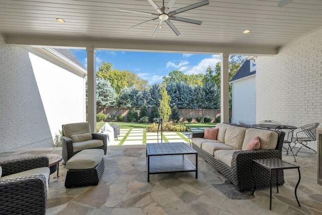 view of patio featuring an outdoor living space and ceiling fan