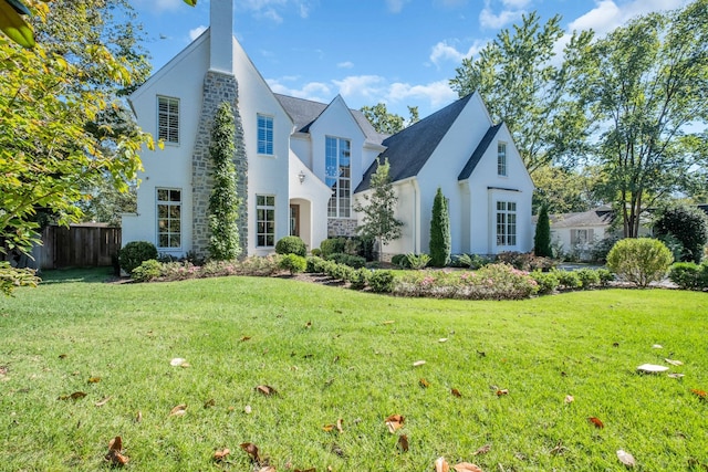 view of home's exterior with a lawn