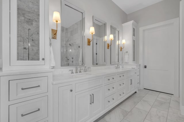 bathroom featuring vanity and tiled shower