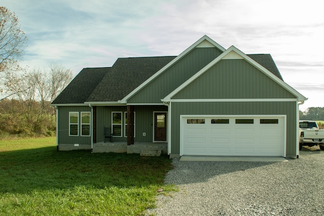 craftsman inspired home featuring a front yard and a garage