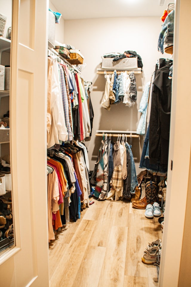 spacious closet featuring hardwood / wood-style flooring