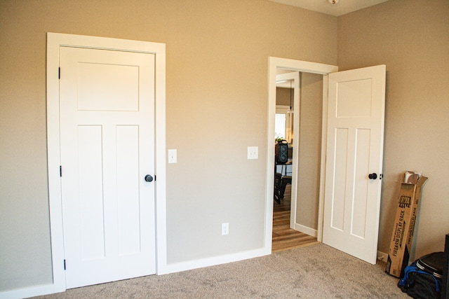 unfurnished bedroom with carpet flooring