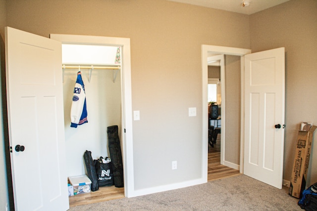 bedroom featuring a closet and light wood-type flooring