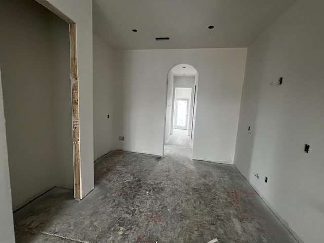 empty room with arched walkways
