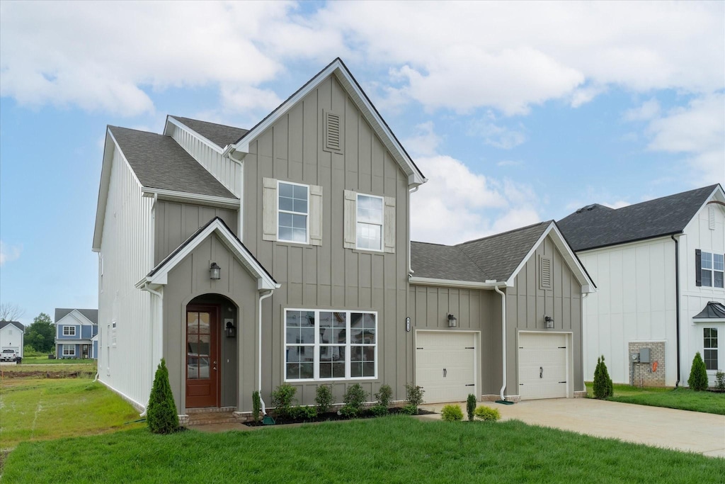4024 Tawnya Charles Ln, Murfreesboro, TN 37128 - view of front facade with board and batten siding, roof with shingles, a front yard, and driveway