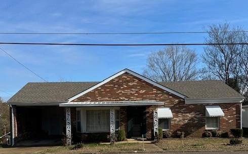 view of front of house with a carport