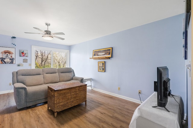 living room with wood-type flooring and ceiling fan