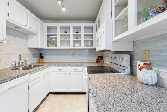 kitchen featuring white cabinets, white appliances, sink, and tasteful backsplash